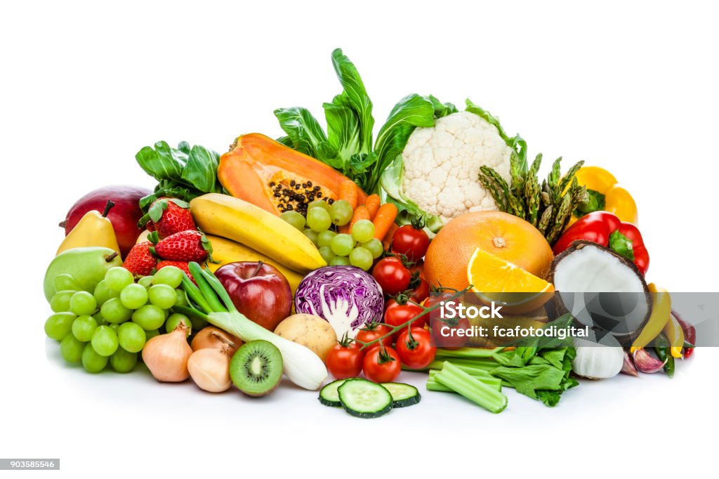 Healthy fresh fruits and vegetables heap isolated on white background Front view of healthy fresh fruits and vegetables heap isolated on white background. Fruits and vegetables included in the composition are orange, kiwi, banana, grape, strawberry, pear, apple, papaya, coconut, garlic, celery, lettuce, bell pepper, onion, cucumber, cauliflower, broccoli, tomato, carrot, cabbage, corn and others. DSRL studio photo taken with Canon EOS 5D Mk II and Canon EF 70-200mm f/2.8L IS II USM Telephoto Zoom Lens Vegetable Stock Photo