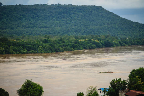 istock A long-tailed boat with full passengers is running upstream against the river tide along muddy of Mekong river at Amphoe Khong Chiam, the easternmost district of Ubon Ratchathani Province of Thailand. 903586108