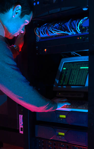 istock Technician Working in Dark Equipment Room at a Terminal 90358674