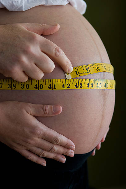 istock Tape measure on pregnant belly 90358751