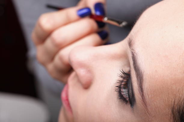 istock Woman applying eyeshadow makeup brush 903594764
