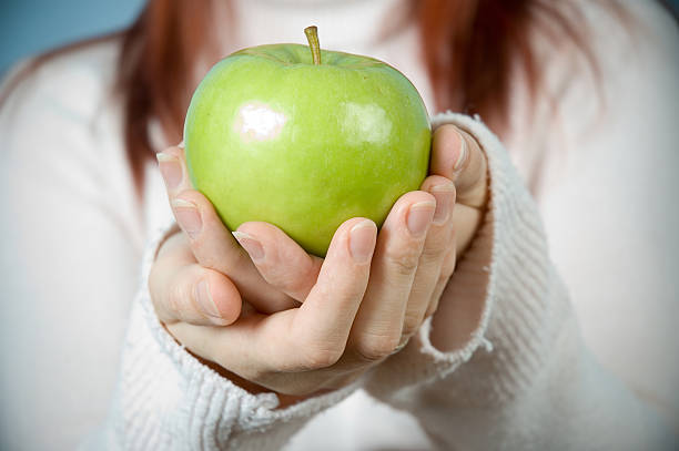 istock Woman holding fresh apple 90359491
