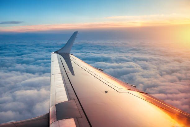 istock Flying above the clouds. Aerial view from the airplane window 903595082