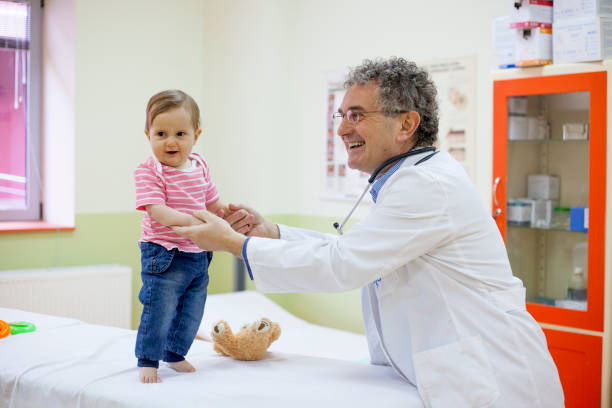 istock Pediatrician with baby 903598132