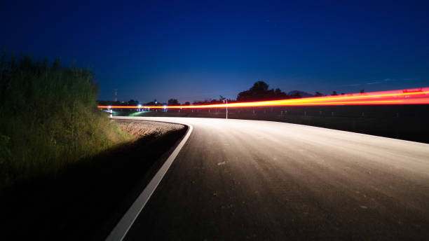 istock Beautiful Curve Road at the night with light tracks long exposure 903601624