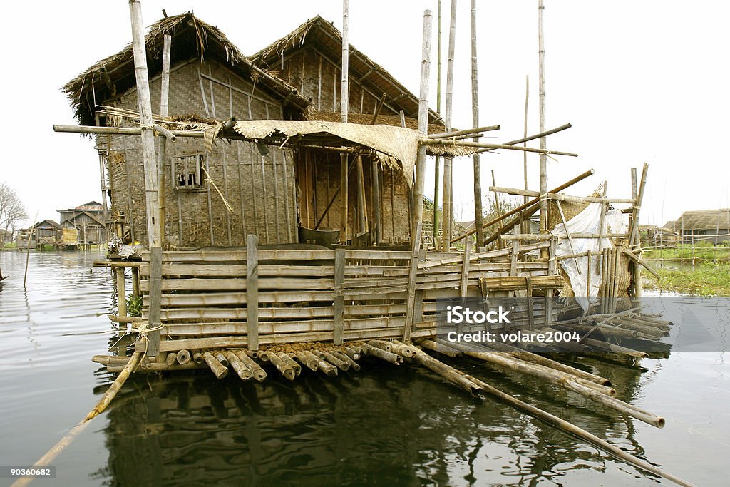 wooden house on water  Architectural Column Stock Photo