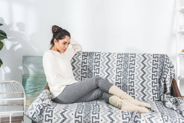 istock attractive young woman at home 903607264
