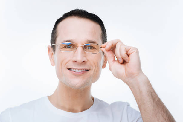 istock Portrait of a positive smart man smiling 903607376