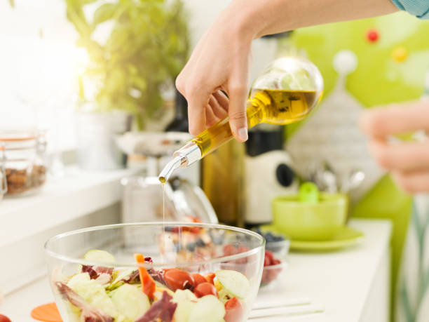 istock Woman preparing a fresh healthy salad 903608948