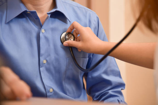 istock Female Doctor examining male patient. 903609666