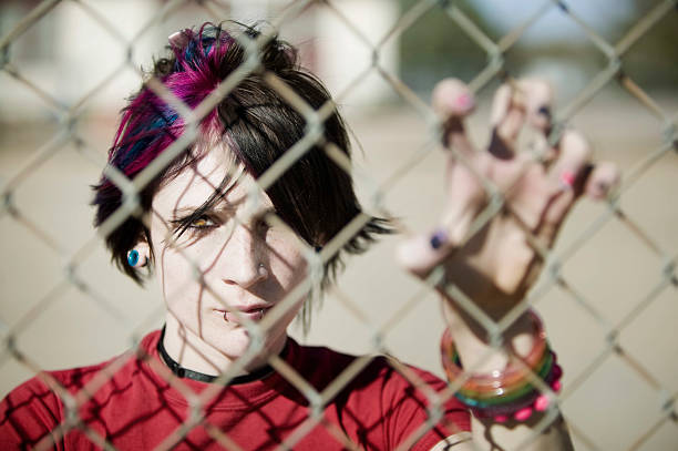 istock Punk Girl Behind Chain Link 90361108