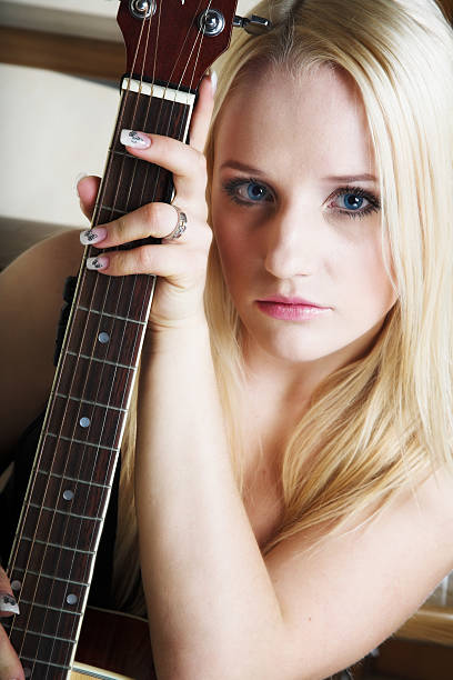 istock The girl with a guitar 90361147