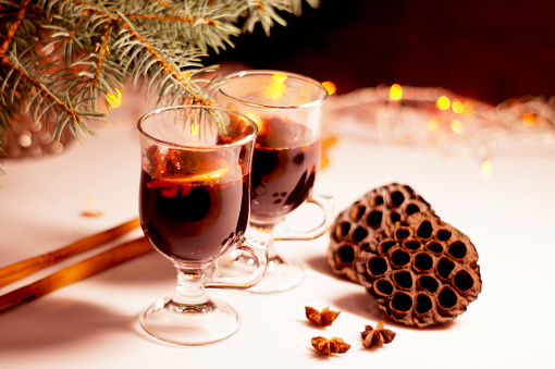 Winter mulled wine for two people Christmas mulled wine. Holiday concept decorated with  branches