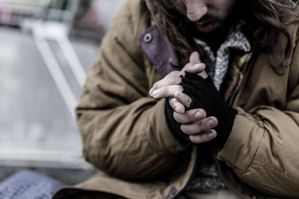 Close-up of dirty beggar's hands Close-up of dirty hands of beggar. Problems of homeless person in the city concept homelessness photos stock pictures, royalty-free photos & images