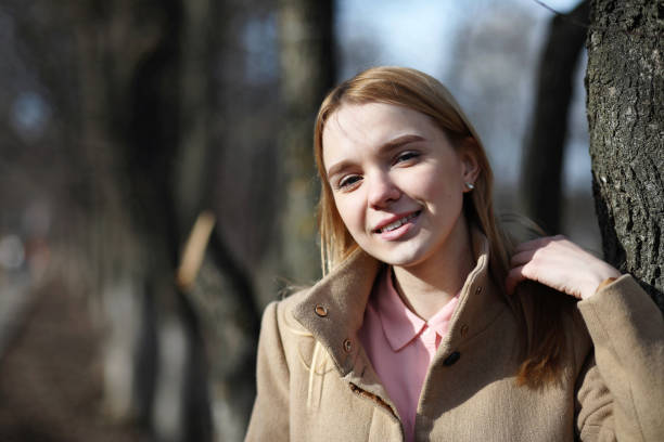 istock Cute blonde in a city park 903618648