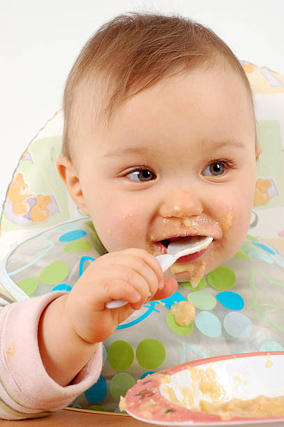 istock eating baby girl 90362037