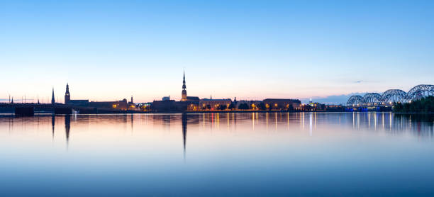 istock Riga cityline panorama in early morning 903625342