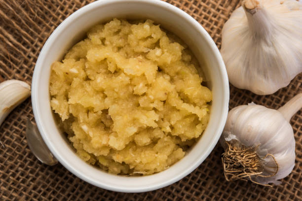 istock Garlic Paste or Toum or Toumya with raw garlic, isolated over white backgroundGinger/Garlic Powder 903625536