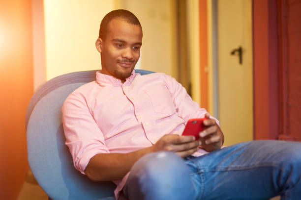 istock Positive talented businessman in casual clothes watching training webinar for improving skills and knowledge on smartphone connected to 4G internet,young writer in good mood spending leisure time 903626076