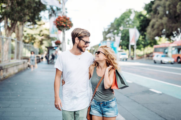 istock Couple goes shopping -  summer sales are here 903632620