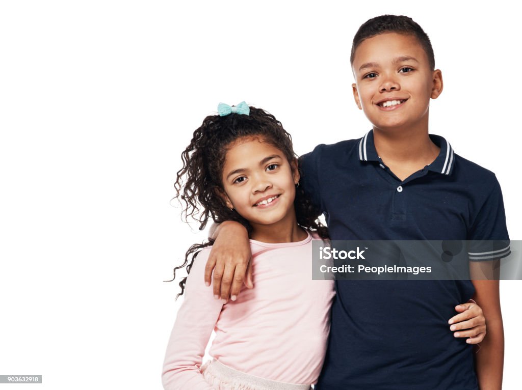 Brother and sister, aka, best friends Studio portrait of a happy boy and girl embracing one another against a white background Child Stock Photo