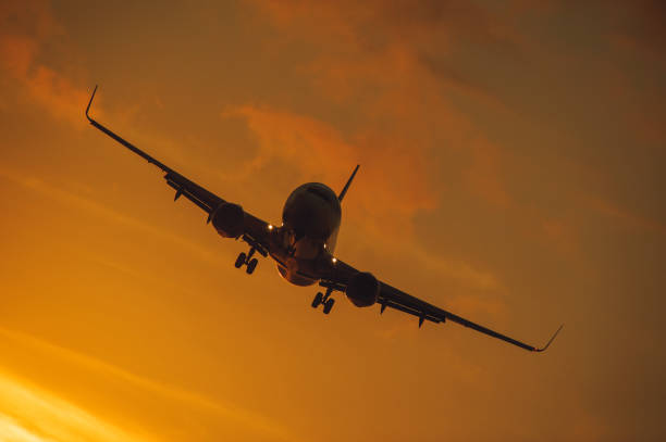 istock Silhouette of the big plane on a sunset background. 903636168