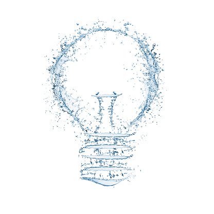 Splashing water forms the shape of a light bulb. The shape is isolated on a white background with a clipping path. The water is blue and transparent with droplets of water splashing either side of the main shape.