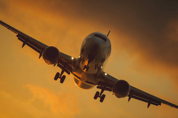 istock Silhouette of the big plane on a sunset background. 903636618