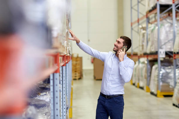 istock happy man calling on smartphone at warehouse 903638210