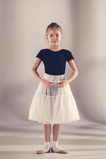 istock The little balerina dancer on gray background 903641188