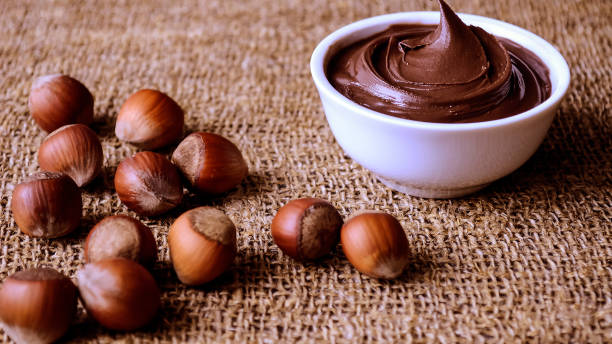 istock Hazelnuts and nuts lying the table. Healthy snack food. Dessert 903645430