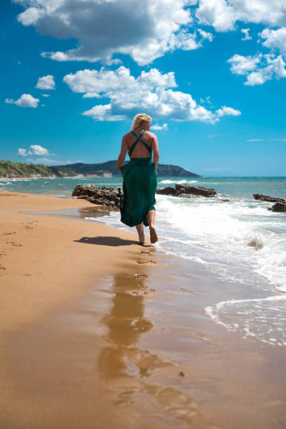 istock Woman on the beach 903648592