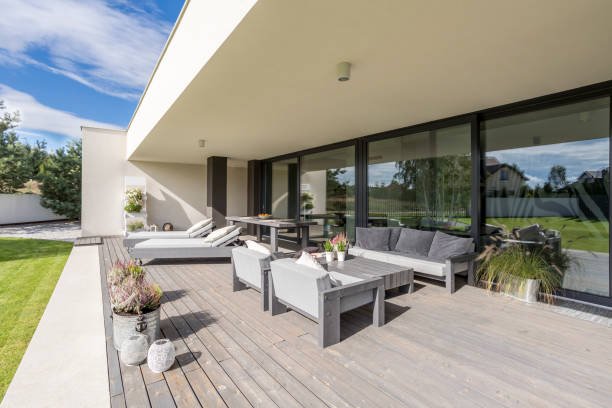 istock Grey garden furniture on board floor 903649664