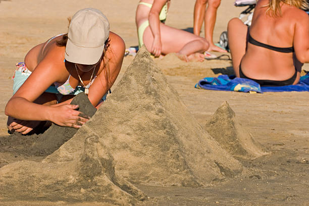 istock Sexy woman making sand pyramids 90364972