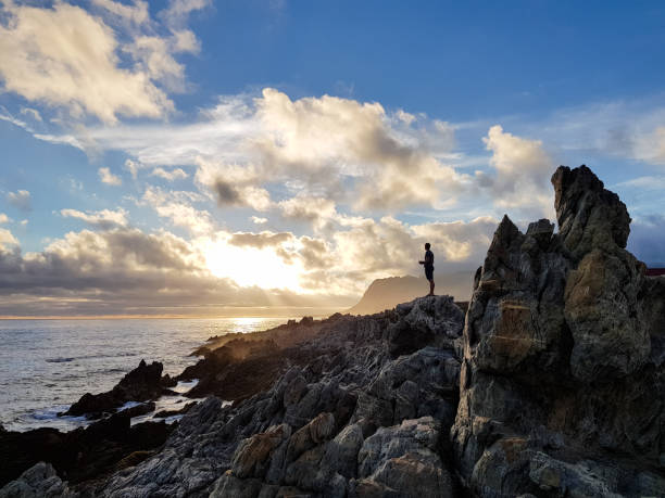 istock Man flying a drone quadrocopter at sunset 903650134