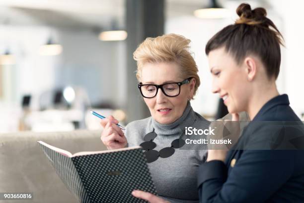 Senior Adviser Talking With Young Businesswoman Stock Photo - Download Image Now - Business, Role Model, Advice