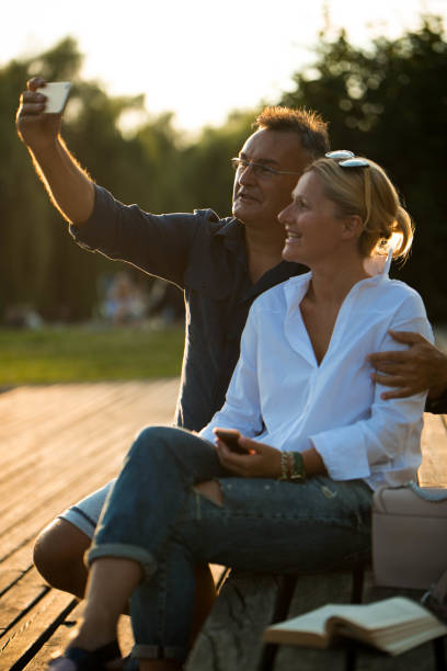 istock Couple making selfie in a sunset 903653460