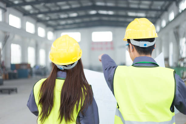 istock young asian man and woman work in workshop 903657536