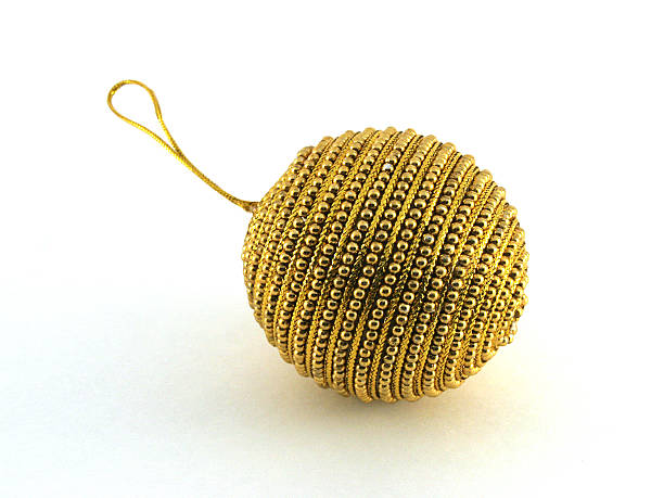 Gold beaded holiday ornament stock photo