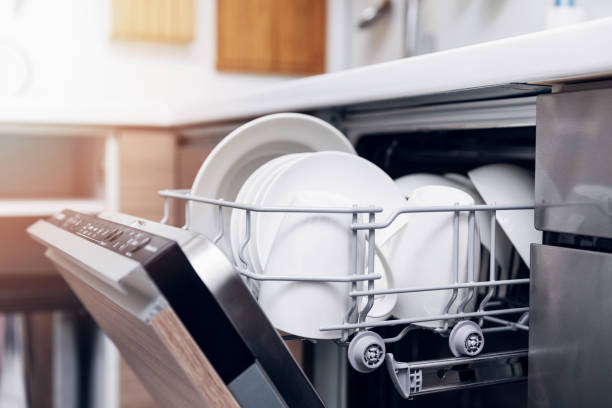 open dishwasher with clean dishes at home kitchen open dishwasher with clean dishes at home kitchen dishwasher stock pictures, royalty-free photos & images