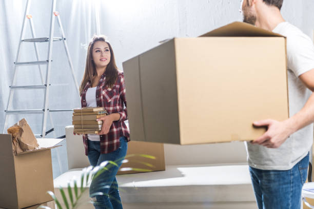 istock Couple unpacking after moving 903658300