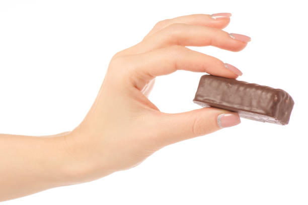 istock Cottage cheese curd  in chocolate glaze in hand 903658576