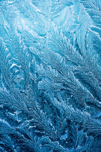 istock The ice-cold frost forms ice crystals in beautiful unique patterns 903658992