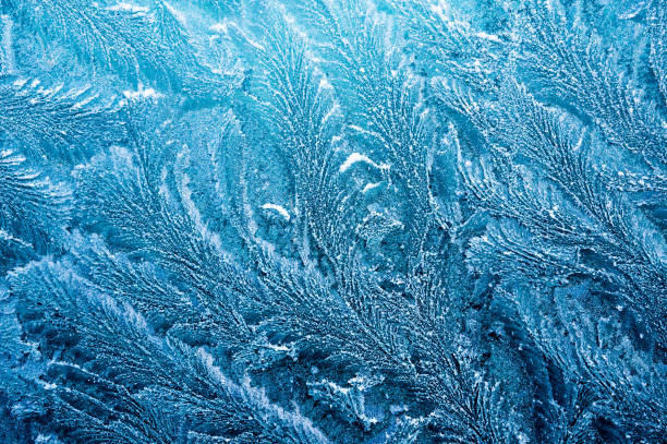 istock The ice-cold frost forms ice crystals in beautiful unique patterns 903659032