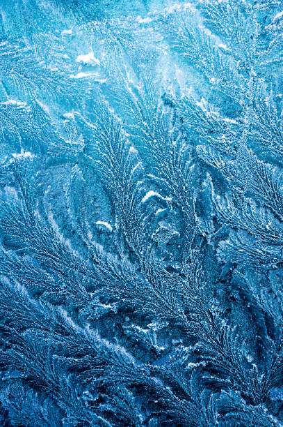 istock The ice-cold frost forms ice crystals in beautiful unique patterns 903659036