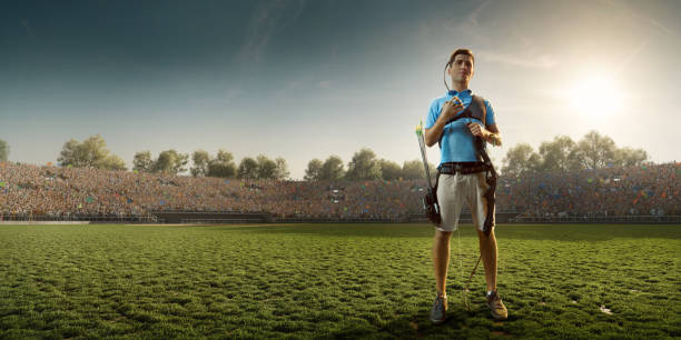 istock Male archer shooting with the longbow at sunset 903659256
