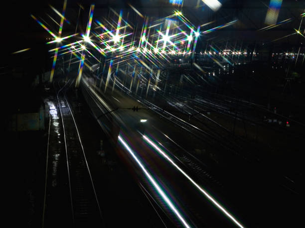 istock The train rushes on the rails at night 903659702