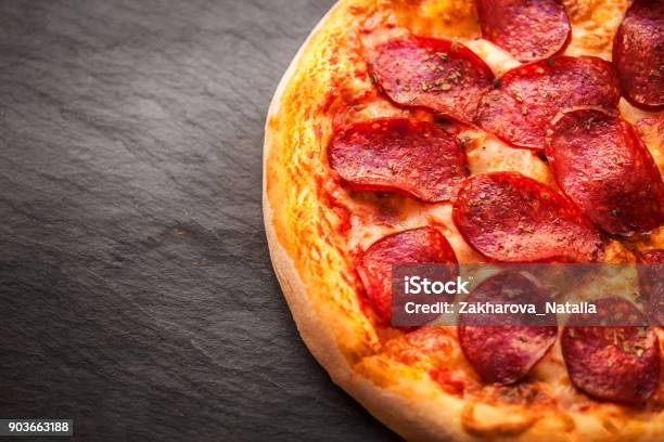 Hot Homemade Pepperoni Pizza Ready To Eat On Black Backgroundn Stock Photo - Download Image Now