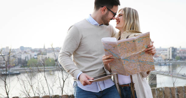 istock Tourist couple exploring city 903663468