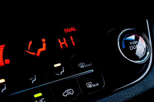 istock Air conditioning button inside a car. Climate control AC unit in the new car. Modern car interior details 903665916